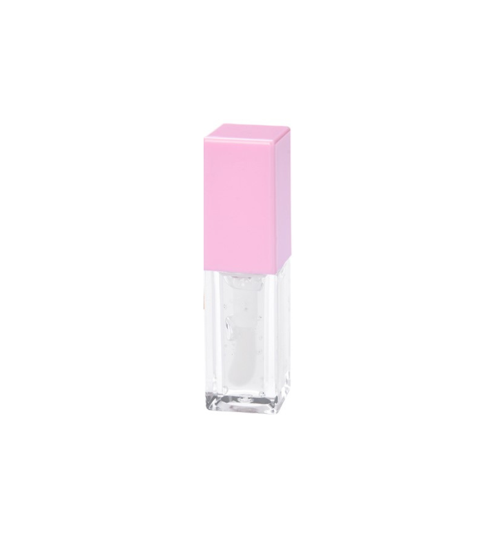 Tube of Pheromones lip gloss with a pink cap and a clear coconut-scented gloss inside, standing on a white background.