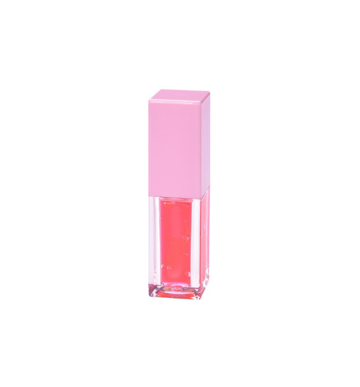 Tube of Pheromones lip gloss with a pink cap and a pomegranate-red gloss inside, standing on a white background.