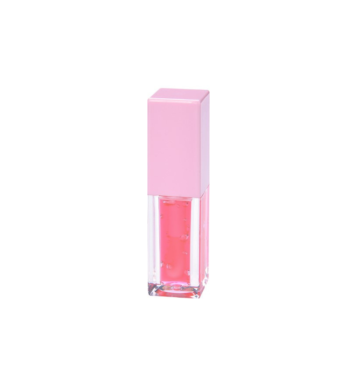 Tube of Pheromones lip gloss with a pink cap and a watermelon-pink gloss inside, standing on a white background.