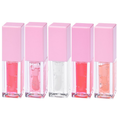 Set of five Pheromones lip gloss tubes with pink caps, arranged in a line, showcasing different shades from clear to vibrant pink.