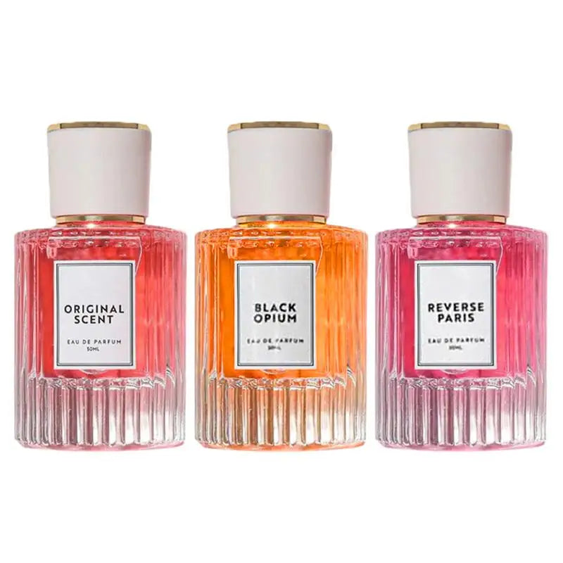 Collection of three elegant perfume bottles: Original Scent, Black Opium, and Reverse Paris